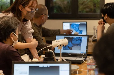 Participants testing products at a user panel in Japan